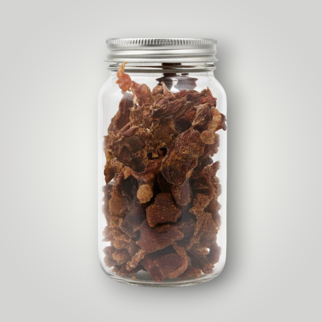 Treat Treat crocodile jerky dog treats shown in a close-up, highlighting the chewy, dried reptile meat snack for dogs.