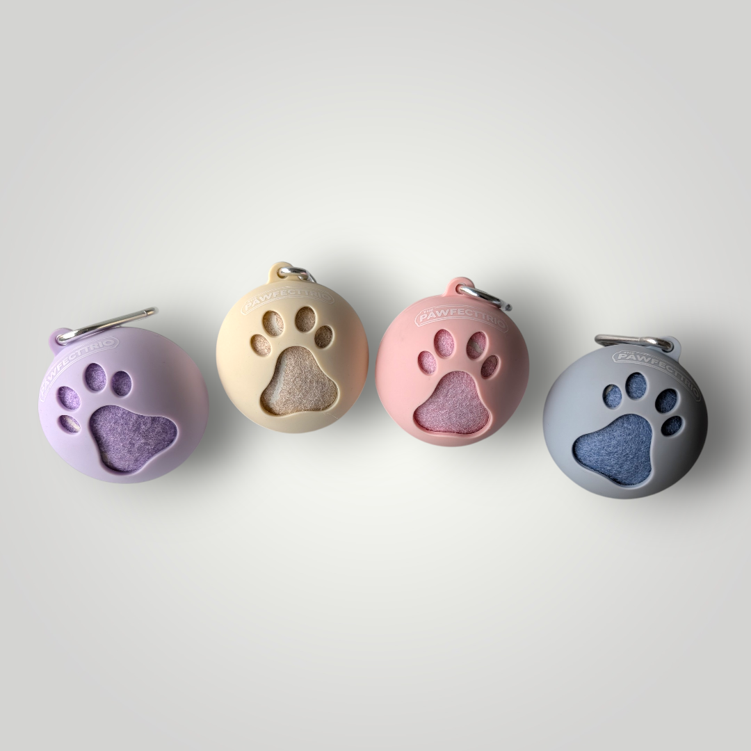 The Pawfect Trio tennis ball holder pet toy with a colorful design and a secure loop for easy carrying and play.