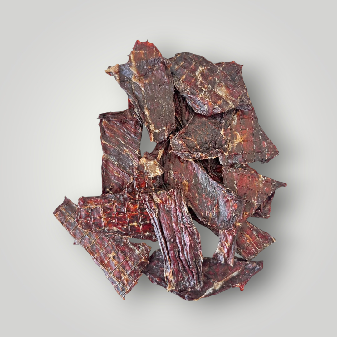 Dog treats featuring beef jerky from Treat Treat, shown as crunchy, savory dog treats on a white background.