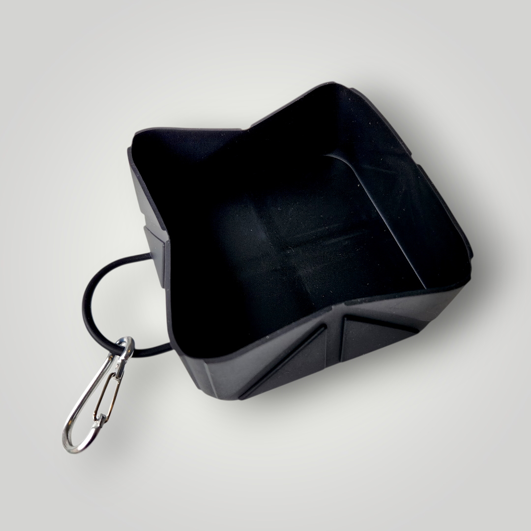 Foldable dog travel bowl by The Pawfect Trio, compact pet accessory for easy hydration on the go, made of durable material.