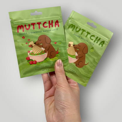 Doggie Matcha Latte Duo by The Pawfect Trio, dog treats in colorful packaging with images of dogs and matcha latte ingredients.