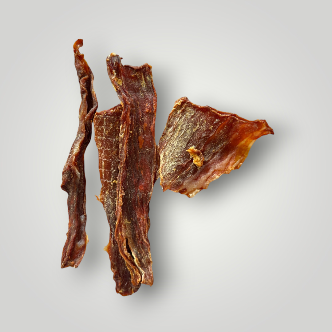 Treat Treat Crocodile Chips dog treats shown in a clear image, highlighting their crocodile shape and crispy texture.