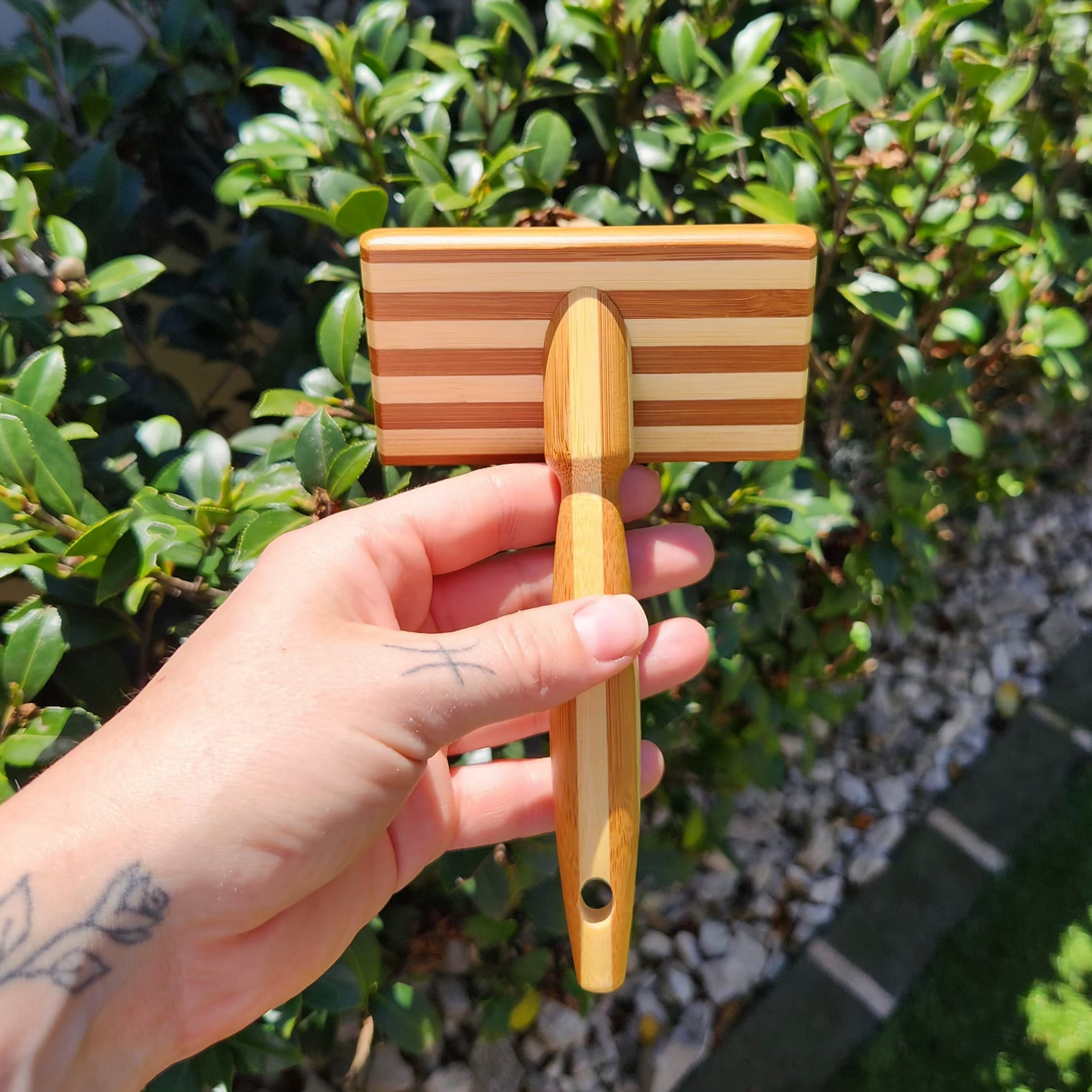 Bamboo Slicker Brush for pets by The Pawfect Trio, with soft bristles for grooming cats and dogs.