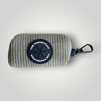 Corduroy dog poop pouch by The Pawfect Trio with a compact design and clip for easy attachment to leash or bag.