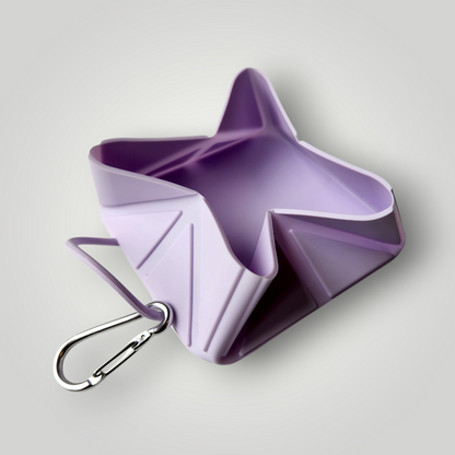 Foldable dog travel bowl by The Pawfect Trio, portable pet accessory with collapsible design for feeding dogs on the go.