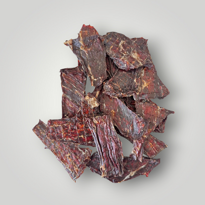 Dog treats featuring beef jerky from Treat Treat, shown as crunchy, savory dog treats on a white background.