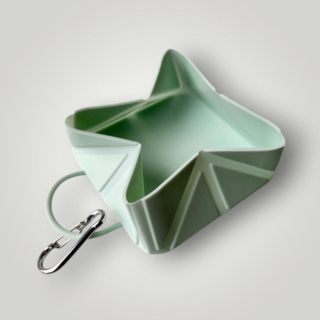 Foldable dog travel bowl from The Pawfect Trio, portable pet accessory for convenient dog feeding on the go.