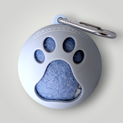 The Pawfect Trio tennis ball holder pet toy showing a colorful fabric container with tennis balls inside.