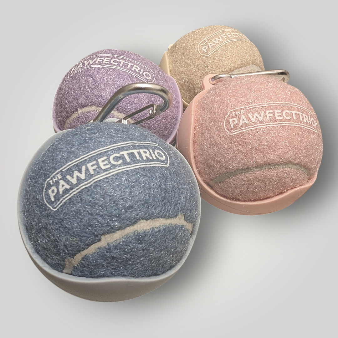 The Pawfect Trio tennis ball holder pet toy with a bright yellow tennis ball inside, designed for dogs to fetch and carry.