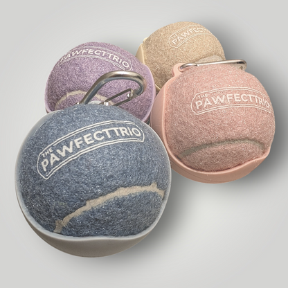 The Pawfect Trio tennis ball holder pet toy with a bright yellow tennis ball inside, designed for dogs to fetch and carry.
